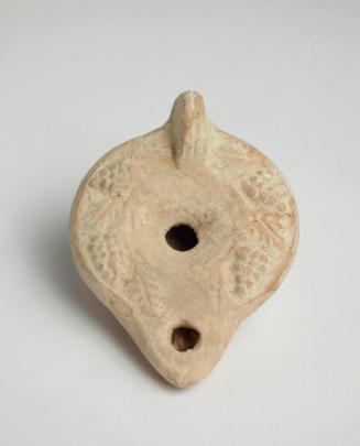 Lug-handled oil lamp decorated with grape vine motif