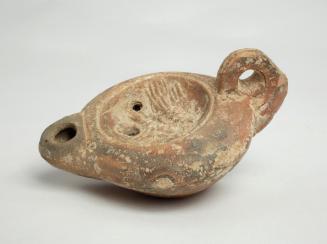 Oil lamp with ring handle; central scene of a bird on a branch eating berries